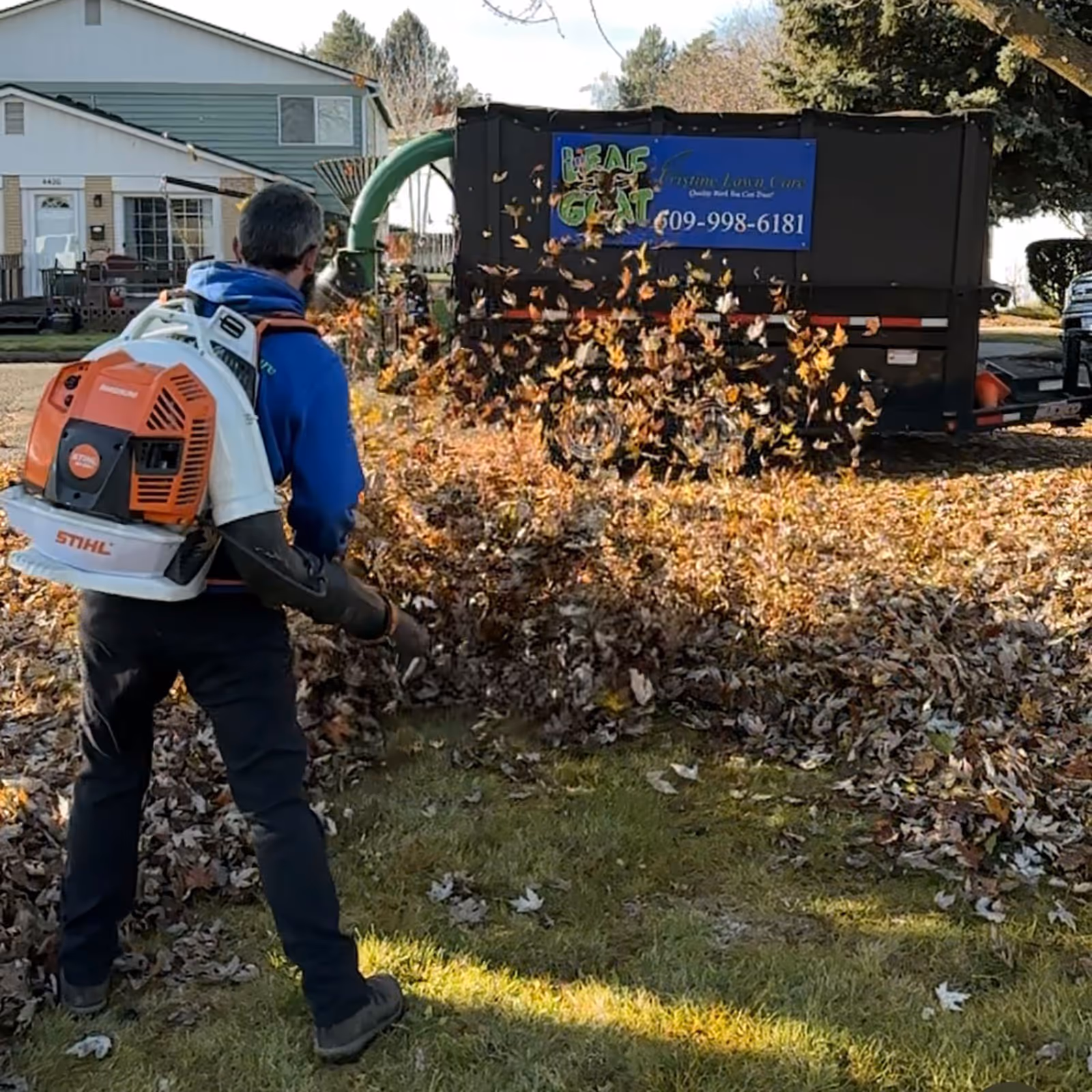 Leaf piles collected at curb for budget cleanup